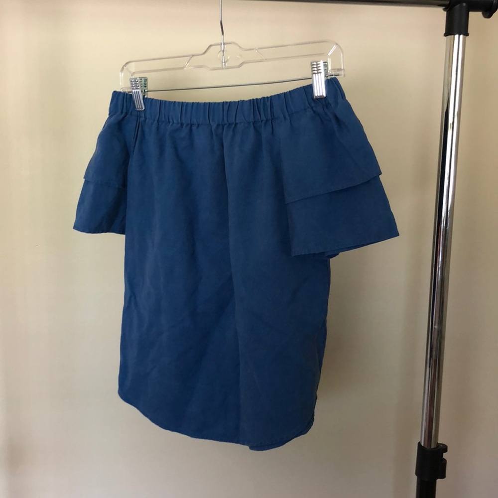 Woman’s off the shoulder top.